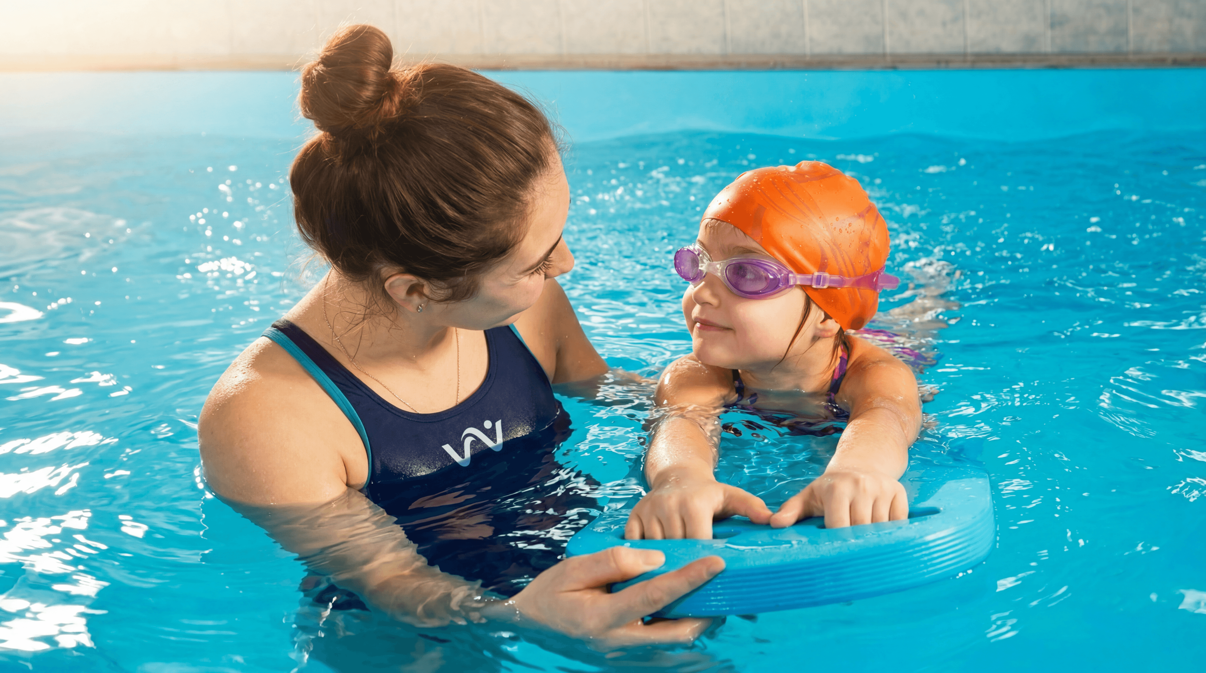 Student smiling in the pool